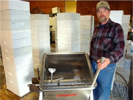 Dennis Lohman assembling a mixer designed for blending pollen supplement